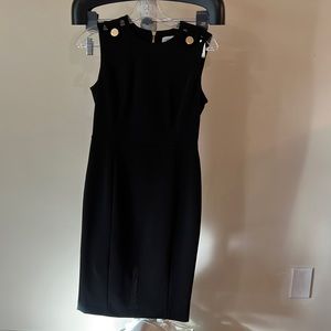 Great little black dress never worn.  Great detail on too and gold zipper